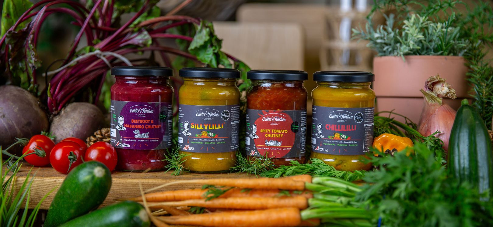 Pickle jars surround by vegetables
