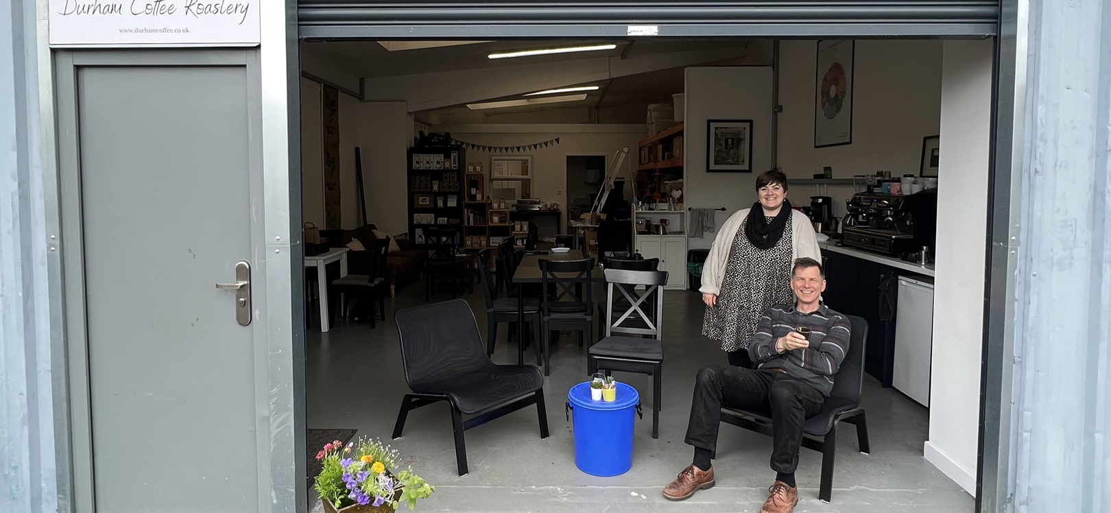 Two people sat in an industrial unit