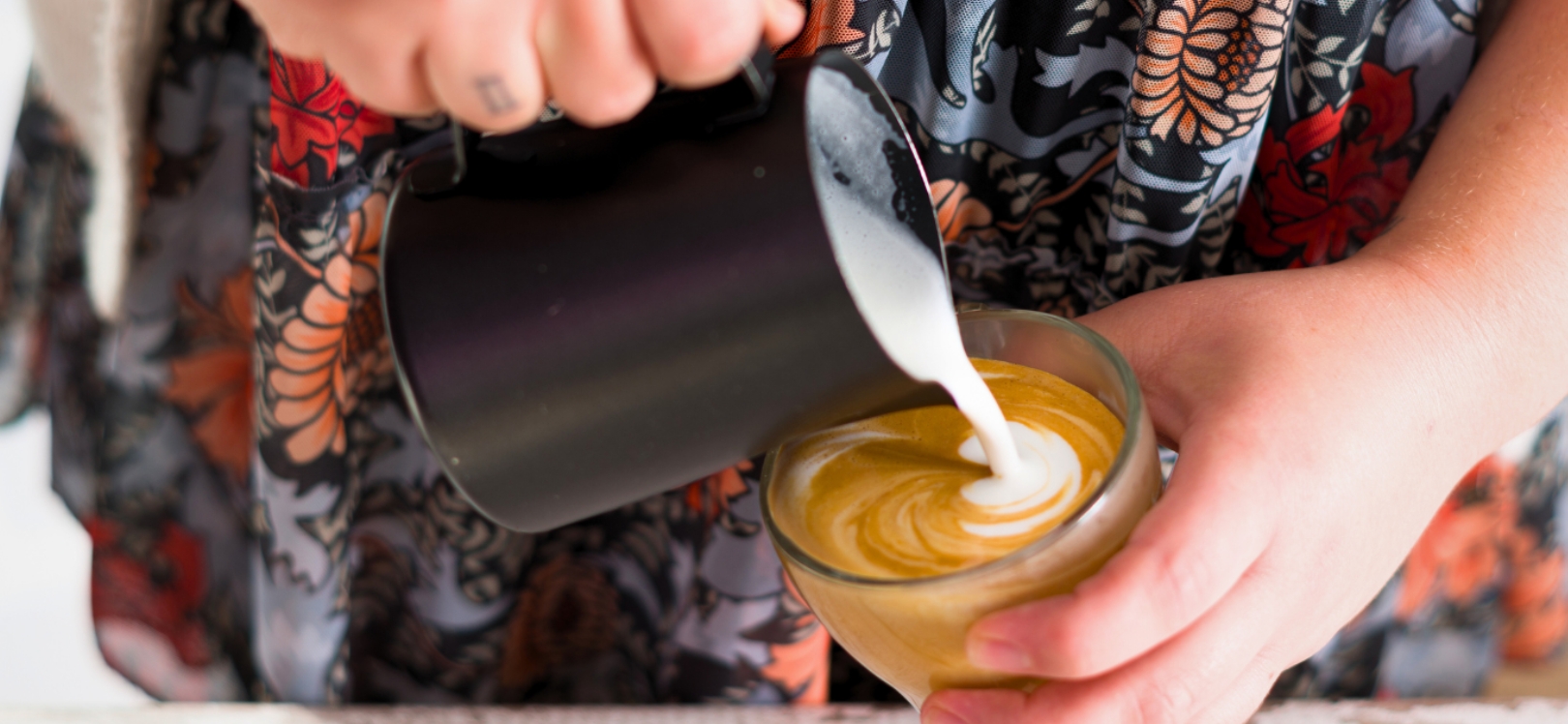 Someone pouring coffee