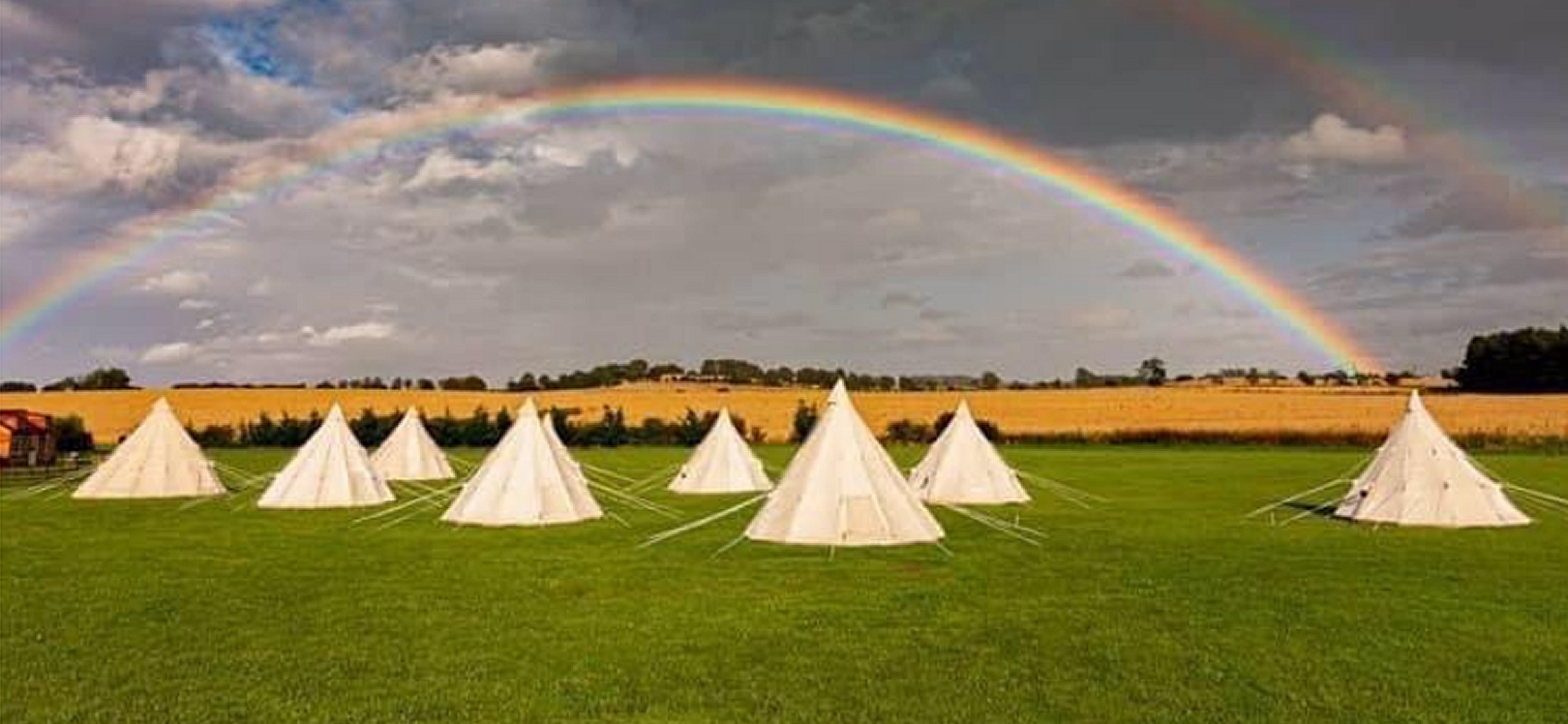 Tepees in a field