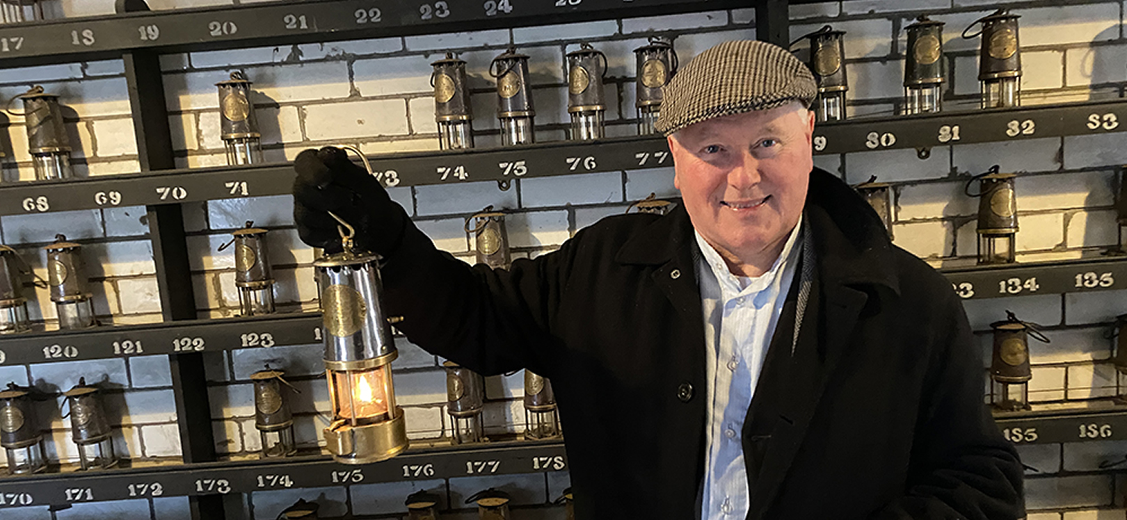 Man holding a Davy lamp at Beamish Museum