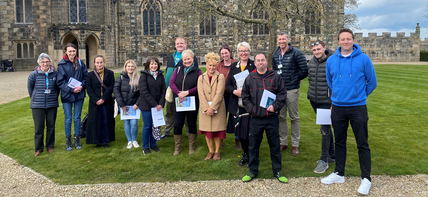 A group of people stood outside of Auckland Castle