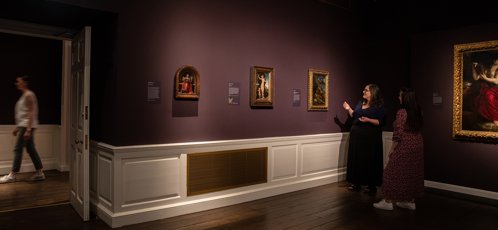 Two people looking at a gallery exhibition