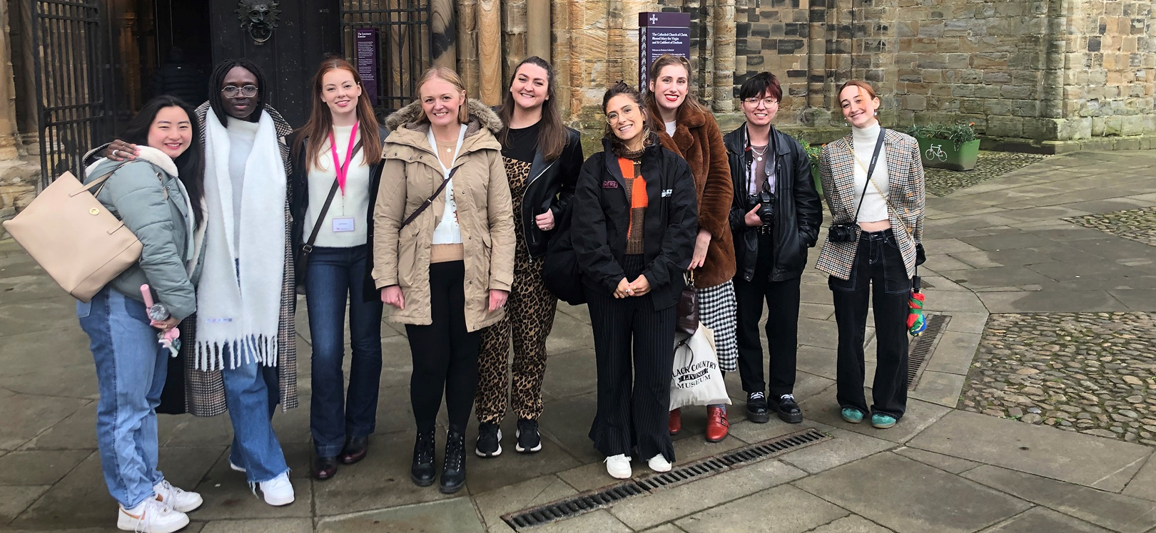 A group of people outside of Durham Cathedral