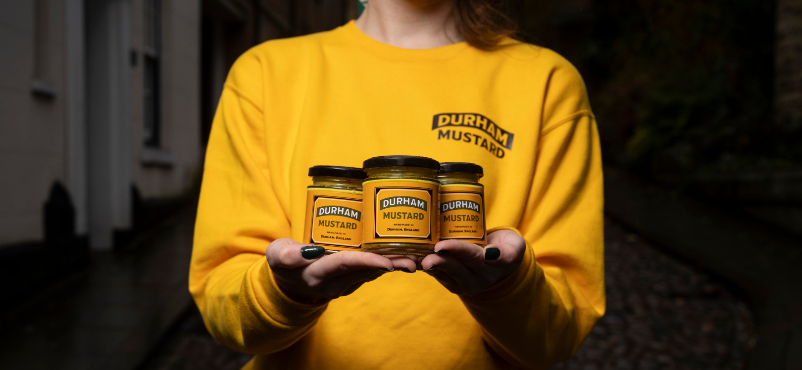 A person holding Durham Mustard