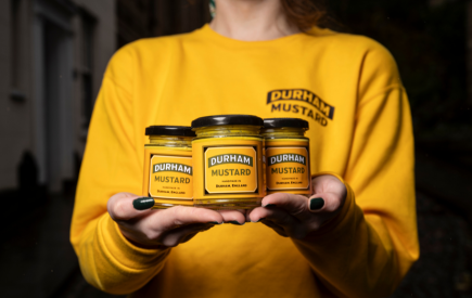 A person holding Durham Mustard