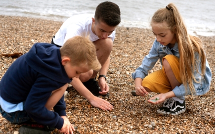 Kids picking up sea glass