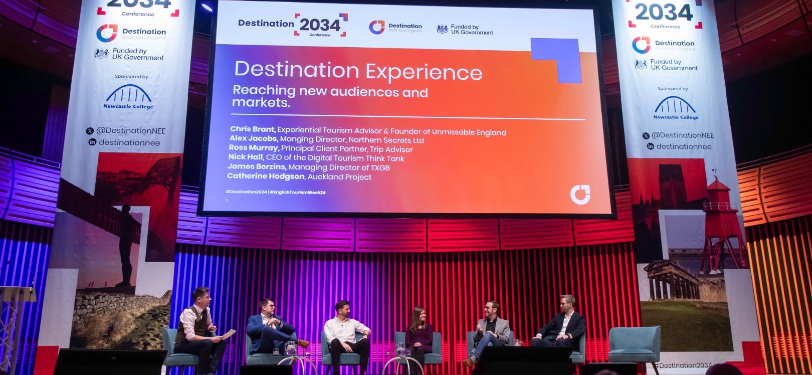 A panel of people on stage at a conference. Credit: Steve Brock Photography