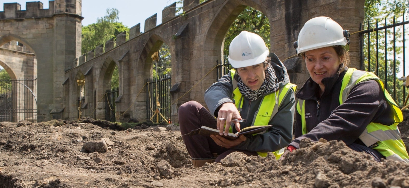 People digging in a hole at Auckland Castle