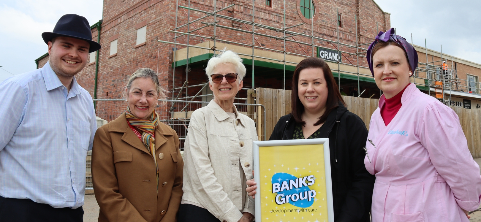 People at Beamish holding a Banks Group sign