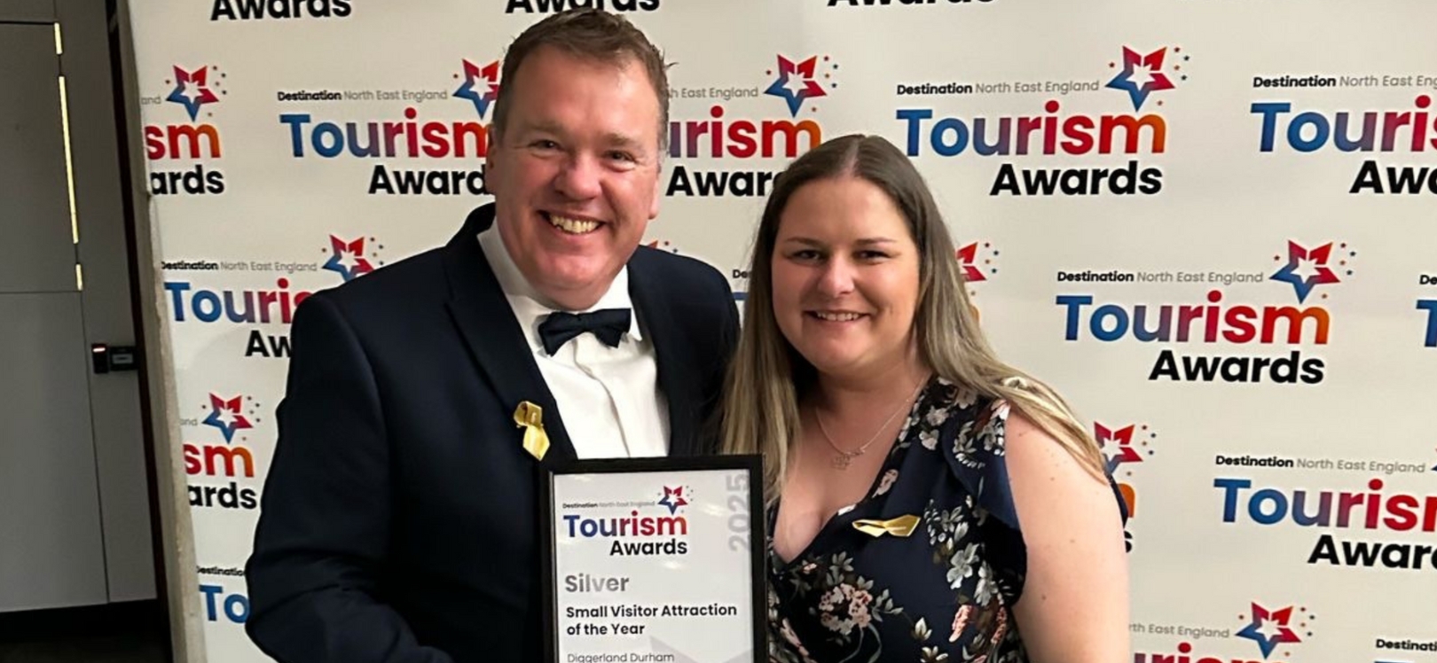 Mark Turner and Jennifer Old, Managers at Diggerland Durham collecting the Silver Award