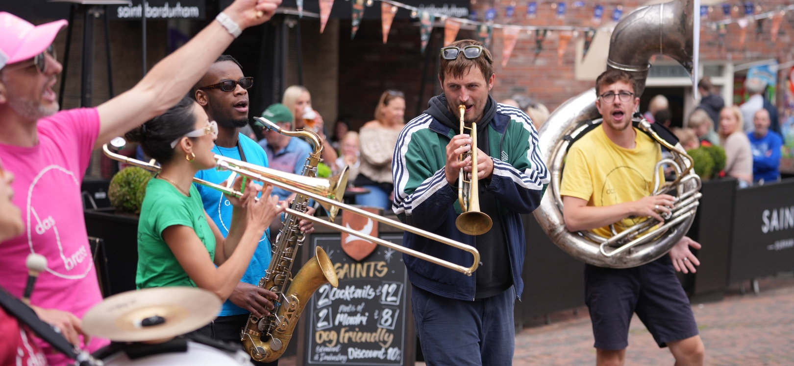 People playing brass instruments in the street
