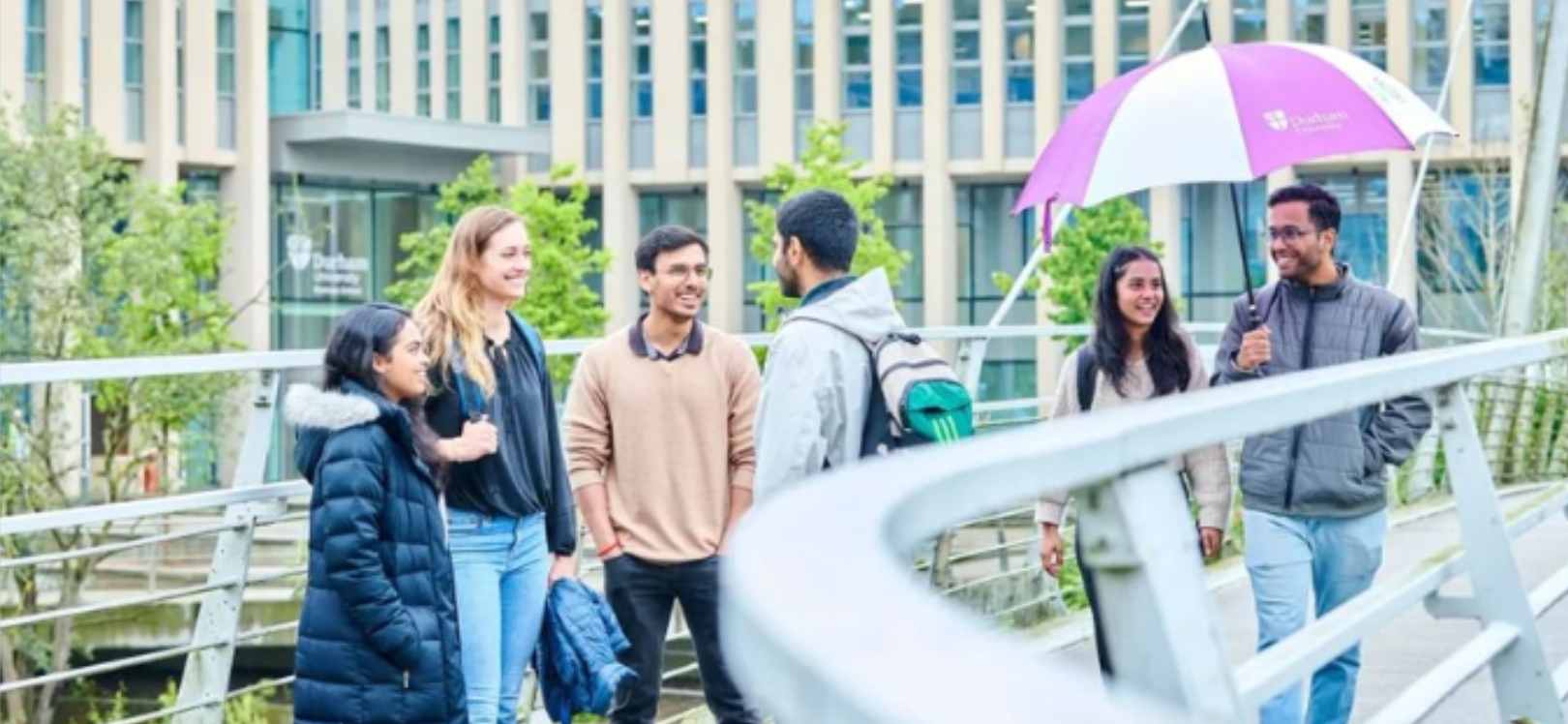 A group of Durham University students outside of the University doors