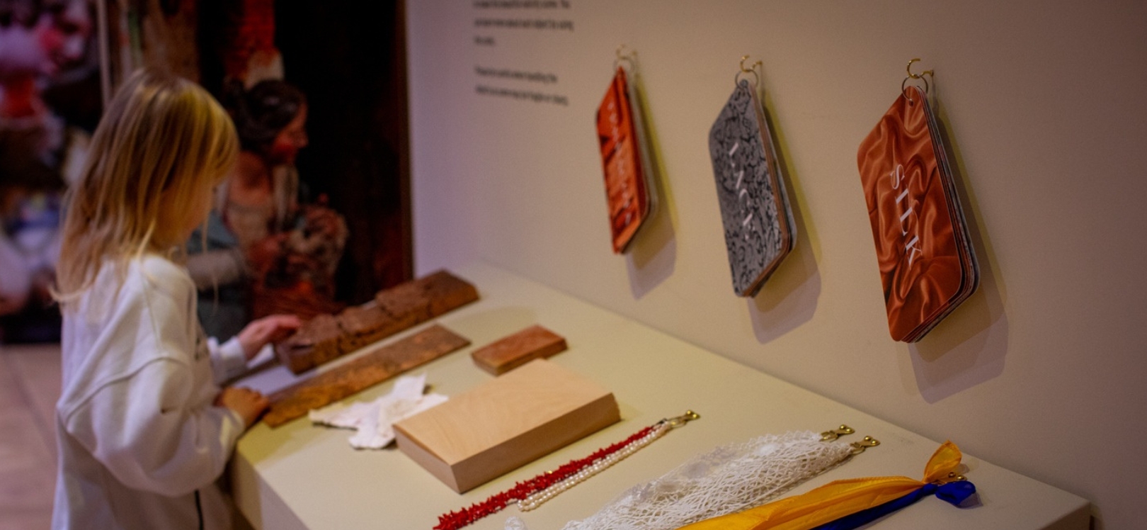 A girl looking at an exhibition at Auckland Palace