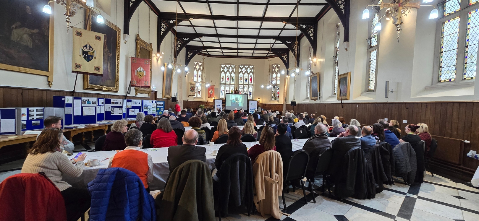 A group of people in a conference hall