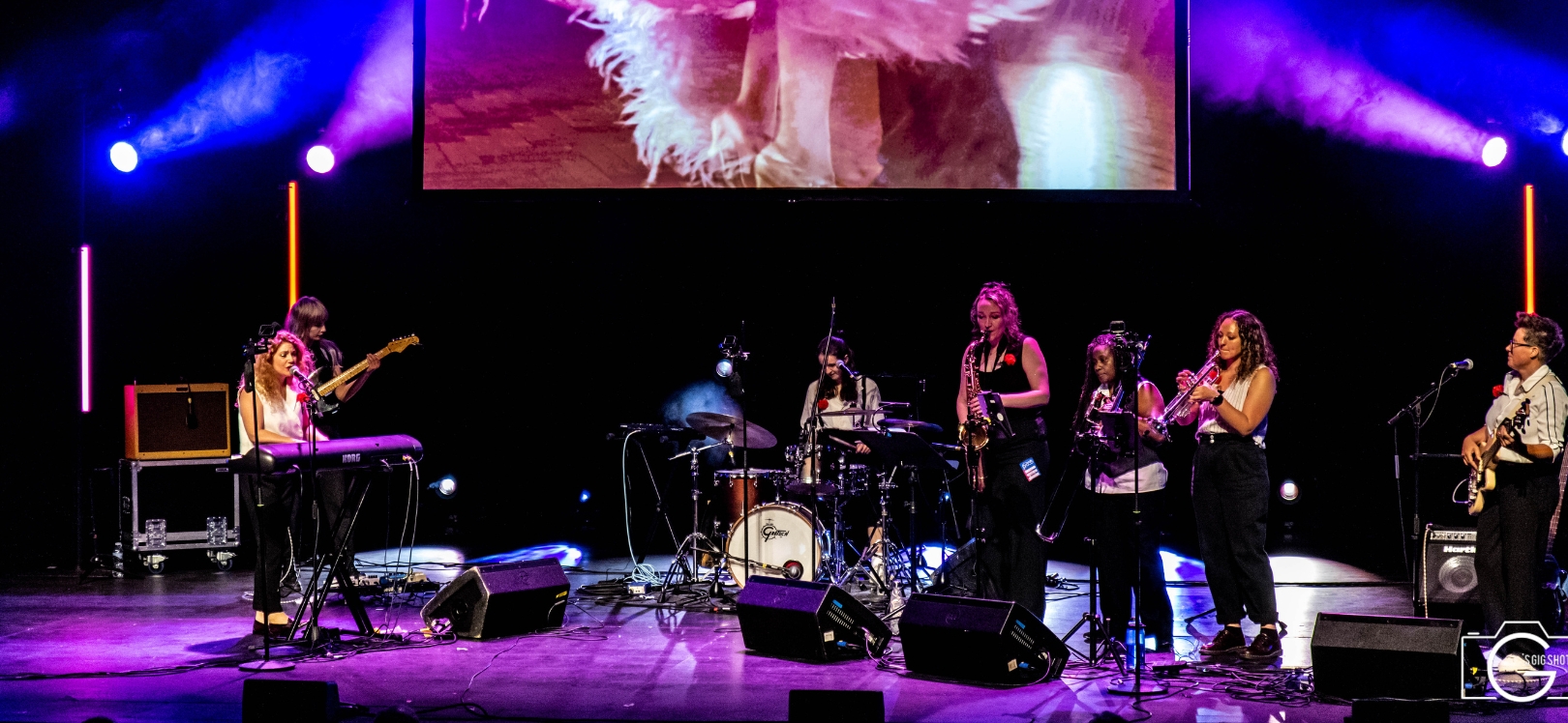 People performing on stage at Brass